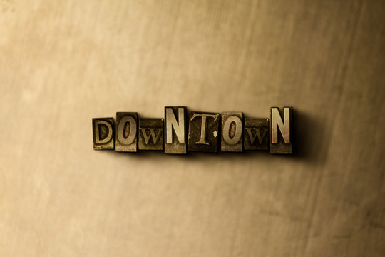 DOWNTOWN - close-up of grungy vintage typeset word on metal backdrop. Royalty free stock - 3D rendered stock image.  Can be used for online banner ads and direct mail.