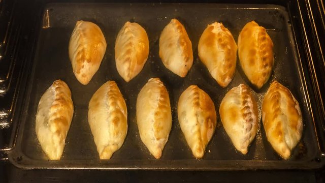 cooking homemade meat pie in oven, time lapse

