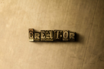 CREATOR - close-up of grungy vintage typeset word on metal backdrop. Royalty free stock - 3D rendered stock image.  Can be used for online banner ads and direct mail.