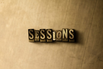 SESSIONS - close-up of grungy vintage typeset word on metal backdrop. Royalty free stock - 3D rendered stock image.  Can be used for online banner ads and direct mail.
