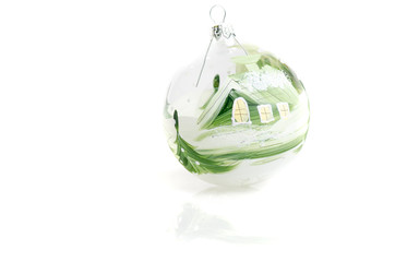 Christmas tree glass ball green with cabin painted isolated on w