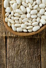 white butter beans on wooden surface
