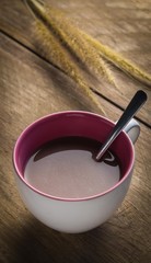 Hot chocolate cup on wooden table