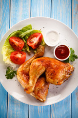 Roasted chicken legs and vegetables