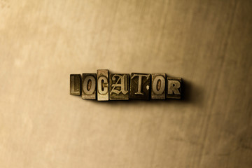 LOCATOR - close-up of grungy vintage typeset word on metal backdrop. Royalty free stock - 3D rendered stock image.  Can be used for online banner ads and direct mail.