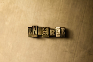 ENLARGE - close-up of grungy vintage typeset word on metal backdrop. Royalty free stock - 3D rendered stock image.  Can be used for online banner ads and direct mail.