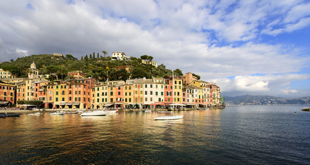 Fototapeta na wymiar The harbor of Portofino with boats and the colorful houses. Genova, Liguria, Italy
