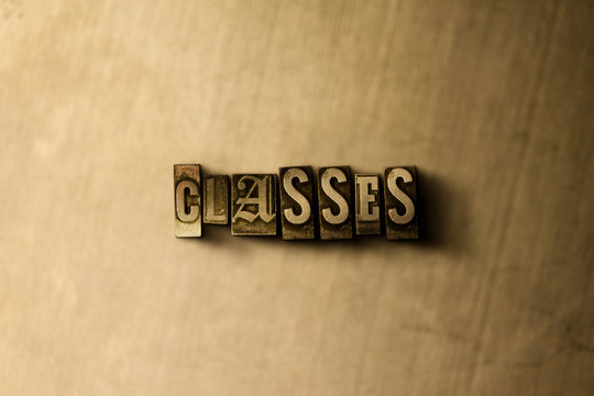 CLASSES - close-up of grungy vintage typeset word on metal backdrop. Royalty free stock - 3D rendered stock image.  Can be used for online banner ads and direct mail.