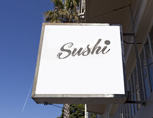 SUSHI sign on building with copyspace. Horizontal.