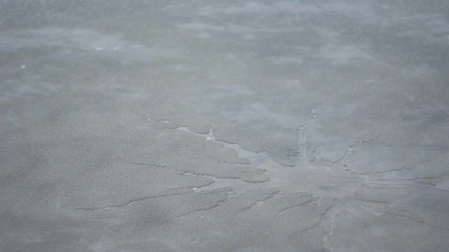 frozen lake broken ice water swayed