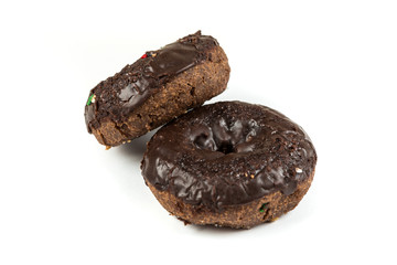 Chocolate frosted cake donuts isolated on a white background