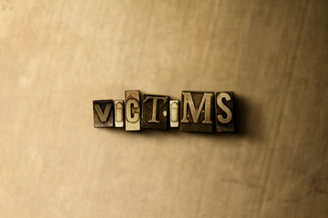 VICTIMS - close-up of grungy vintage typeset word on metal backdrop. Royalty free stock - 3D rendered stock image.  Can be used for online banner ads and direct mail.