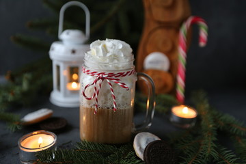 Christmas hot chocolate with ornaments and candy cane. Christmas and New Year decorations