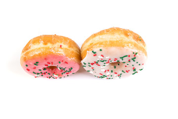 Raised frosted donuts isolated on a white background