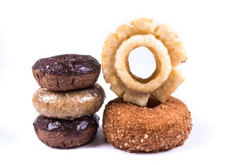 Assorted glazed and frosted donuts isolated on a white background