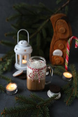 Christmas hot chocolate with ornaments and candy cane. Christmas and New Year decorations
