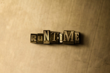 RUNTIME - close-up of grungy vintage typeset word on metal backdrop. Royalty free stock - 3D rendered stock image.  Can be used for online banner ads and direct mail.