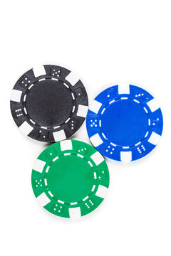 Black, green, and blue poker chips isolated on a white background
