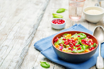 Pomegranate sweet potato quinoa spinach salad