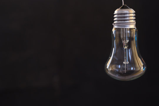 Light bulb on a dark blurred background