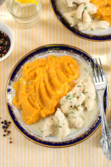 Chicken bites in creamy sauce gravy with estragon tarragon