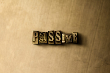 PASSIVE - close-up of grungy vintage typeset word on metal backdrop. Royalty free stock - 3D rendered stock image.  Can be used for online banner ads and direct mail.