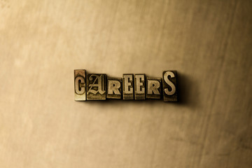 CAREERS - close-up of grungy vintage typeset word on metal backdrop. Royalty free stock - 3D rendered stock image.  Can be used for online banner ads and direct mail.