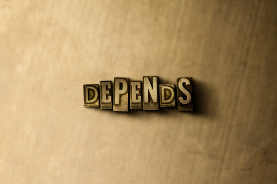 DEPENDS - close-up of grungy vintage typeset word on metal backdrop. Royalty free stock - 3D rendered stock image.  Can be used for online banner ads and direct mail.