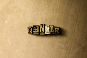 DANGER - close-up of grungy vintage typeset word on metal backdrop. Royalty free stock - 3D rendered stock image.  Can be used for online banner ads and direct mail.