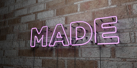 MADE - Glowing Neon Sign on stonework wall - 3D rendered royalty free stock illustration.  Can be used for online banner ads and direct mailers..
