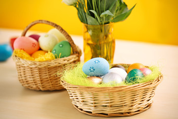 Easter eggs and decorations on table