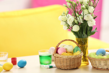 Easter eggs and decorations on table