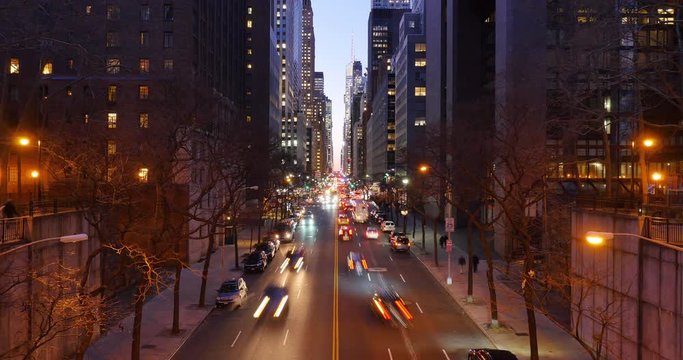 NEW YORK CITY - Circa December, 2016 - A night timelapse establishing shot of the busy activity on 42nd Street as seen from the Tudor City Bridge.  	