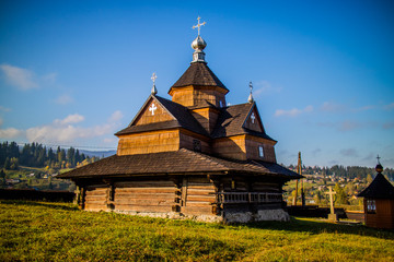 Wooden church in rural area in mountains. Carpathians, autumn 2016