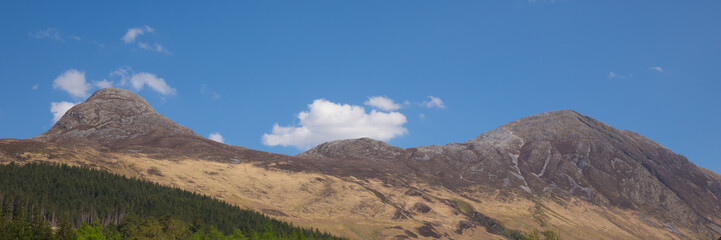Panoramic view to mountains surrounding Glencoe Village Glen Coe Scotland UK 