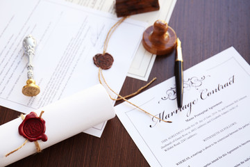 Wax seal, stamp and documents on table