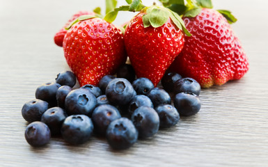 many red ripe strawberries. food blueberry