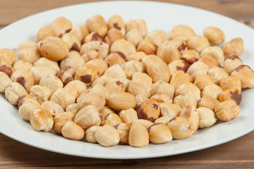 Peeled Baked Hazelnut Nuts On Plate.
