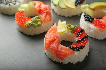 Sushi doughnuts on grey textured background