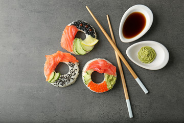 Sushi doughnuts on grey textured background