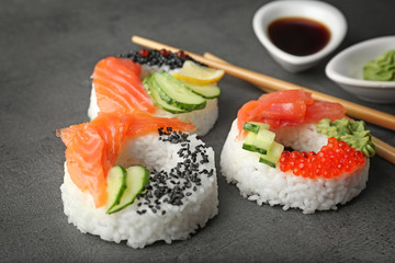 Sushi doughnuts on grey textured background