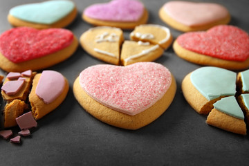 Tasty colourful heart shaped cookies on grey background