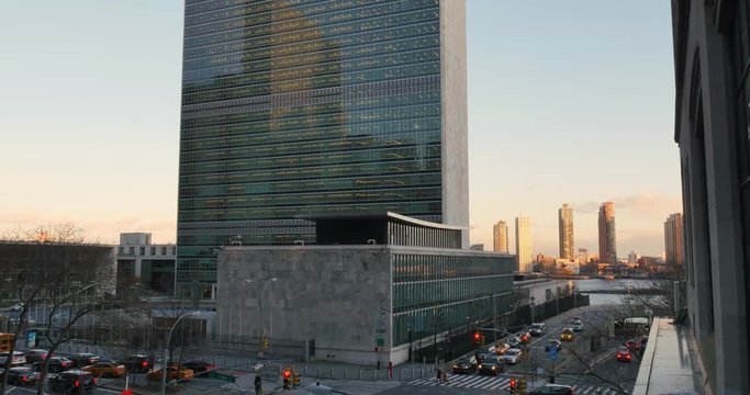 NEW YORK - Circa December, 2016 - A dusk establishing shot of the United Nations Building in Midtown Manhattan.  	