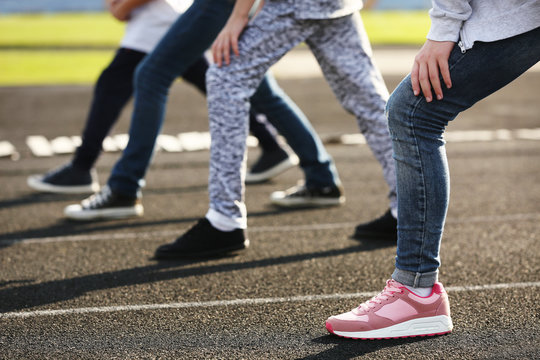 Children in ready position to run on track, closeup