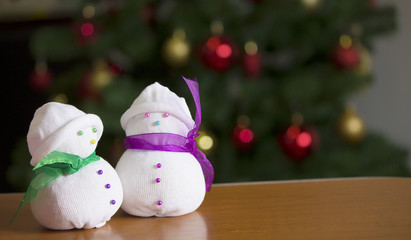 Snowmen with Christmas tree at home