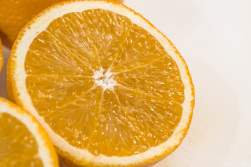 halves of orange close-up isolated on white background