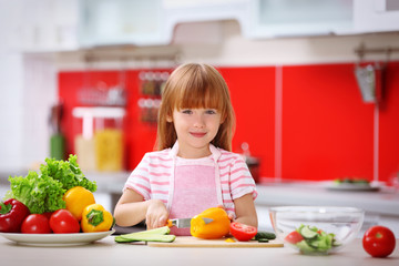 Little girl cooking in the kitchen