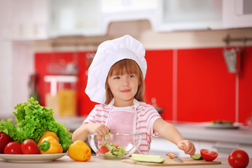 Little girl cooking in the kitchen