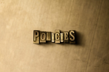 POLICIES - close-up of grungy vintage typeset word on metal backdrop. Royalty free stock - 3D rendered stock image.  Can be used for online banner ads and direct mail.