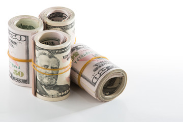 American Fifty Dollar Bills rolled up with a Rubber Band